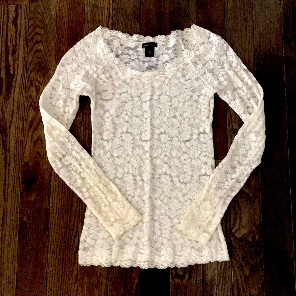 Cream colored, lace, long sleeve shirt.